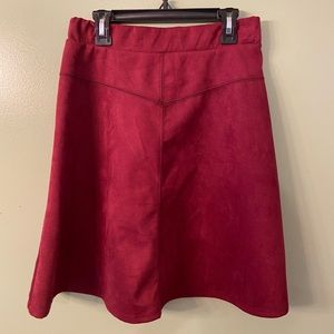 Discreet woman’s suede-like skirt